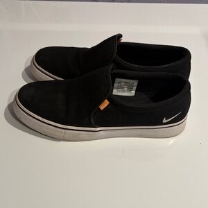 Nike Women’s Black and White Slip-On Sneakers